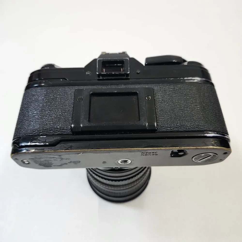 Canon AE-1 Black 35mm SLR Film Camera Sakar MC Zoom 1:3.5-4.5 f 28-80mm